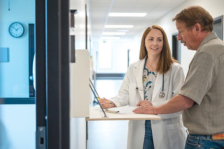 Doctor of nursing student consulting with patient